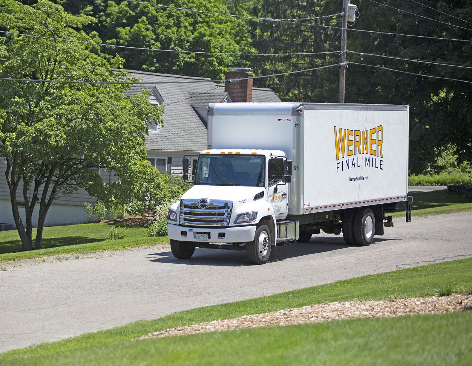 veteran driver in front of a veteran branded werner truck