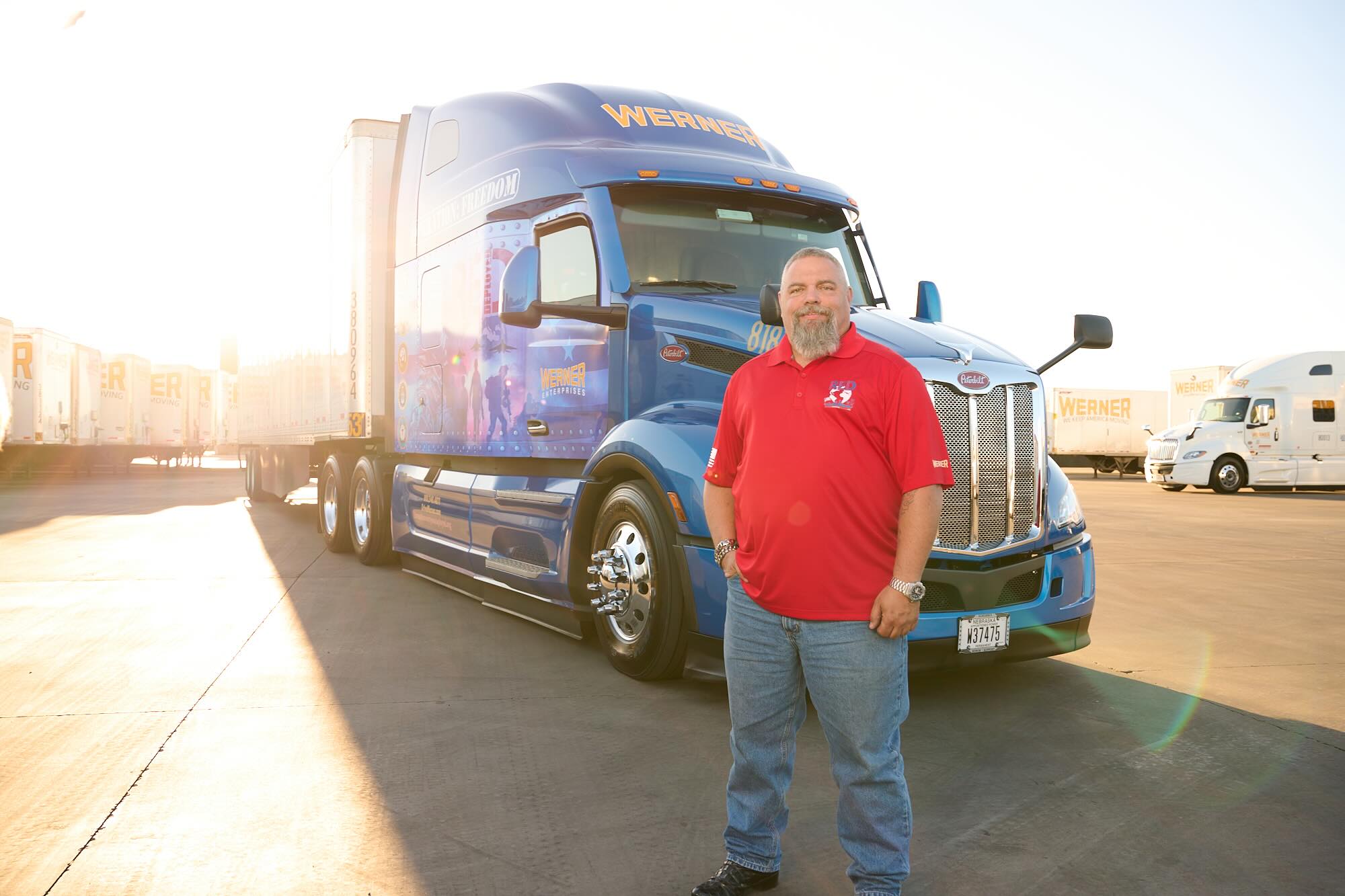 20220309_WERNER_RED_TRUCK_2357 Werner driver standing infront of truck